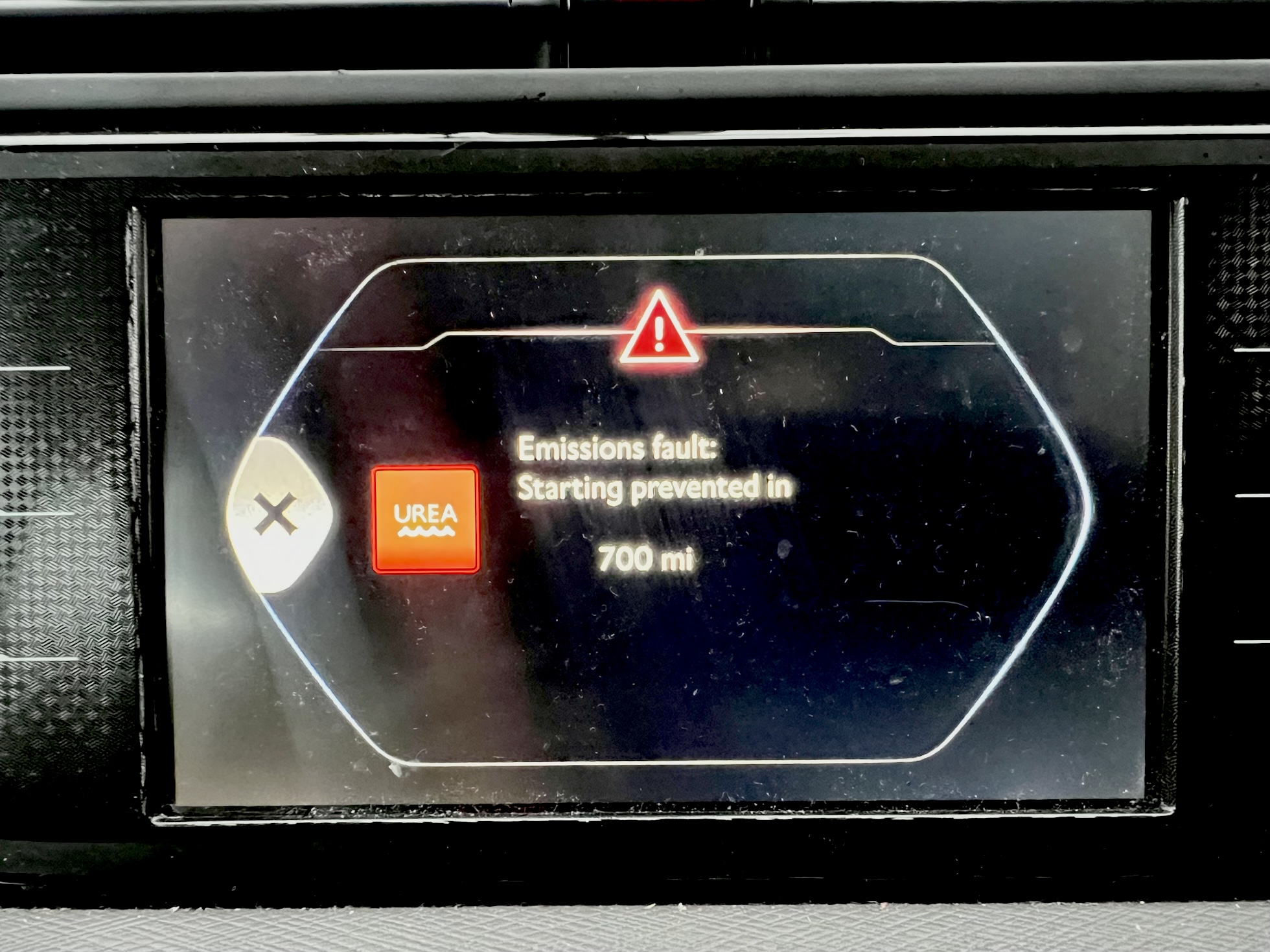 Dashboard display showing AdBlue emissions fault with no-start countdown warning